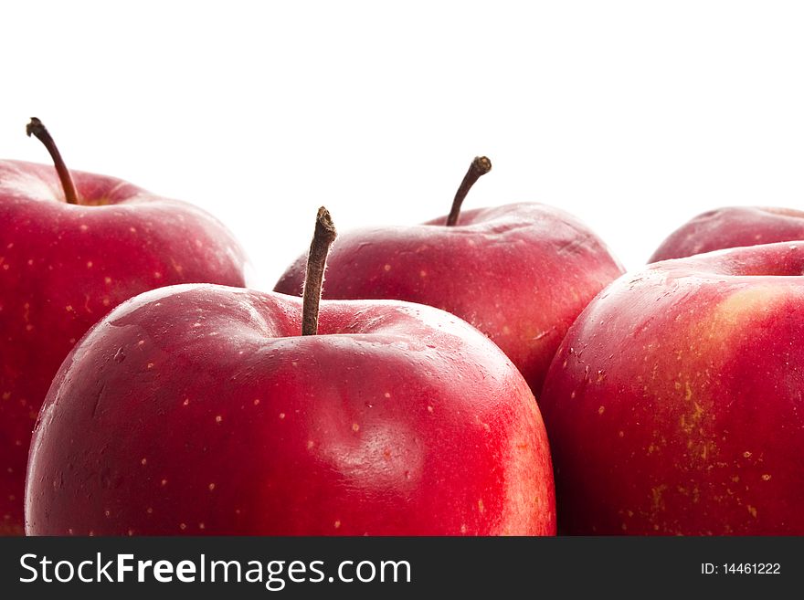 Red apples isolated on white close-up background