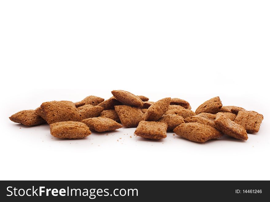 Handful of corn cookies isolated on white