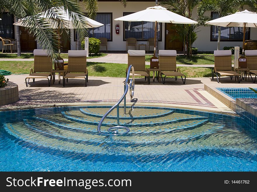 Swimming pool on a sunny day.Pattaya city in Thailand . Swimming pool on a sunny day.Pattaya city in Thailand .