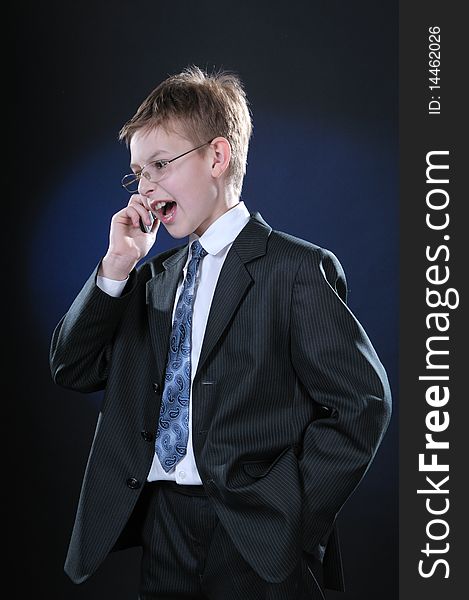 Boy In Suit On Cellphone