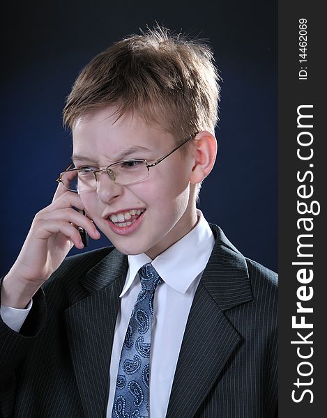 Boy In Suit On Cellphone