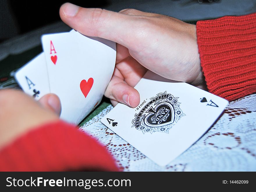 A men who have three aces in hand on a poker game. A men who have three aces in hand on a poker game