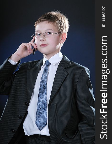 Boy In Suit On Cellphone