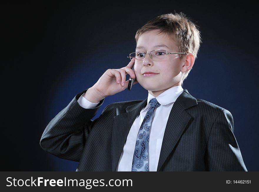 Boy in Suit on Cellphone