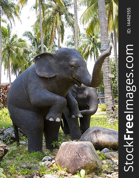 Sculptures of elephants in tropical