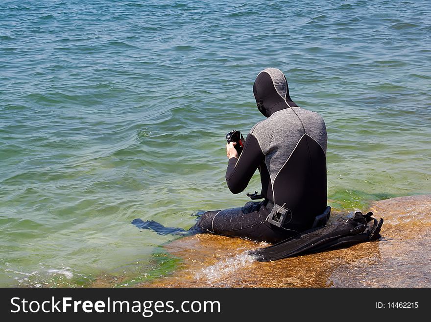 Man in diving equipment, sea