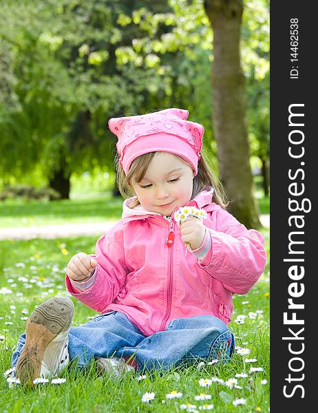 Sweet happy little girl in park