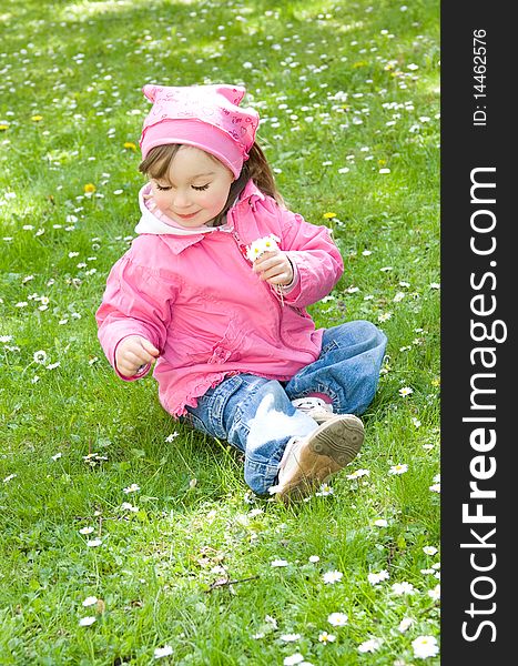 Sweet happy little girl in park