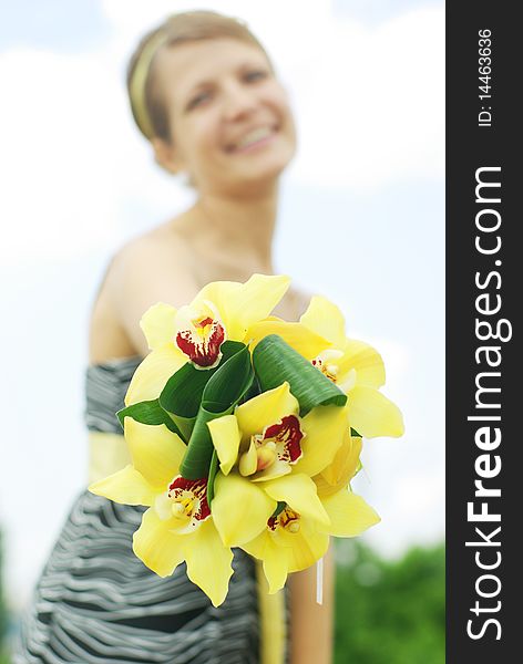 Portrait of the beautiful girl with flowers