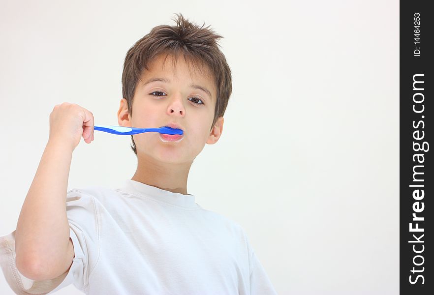 A Boy Cleaning His Teeth