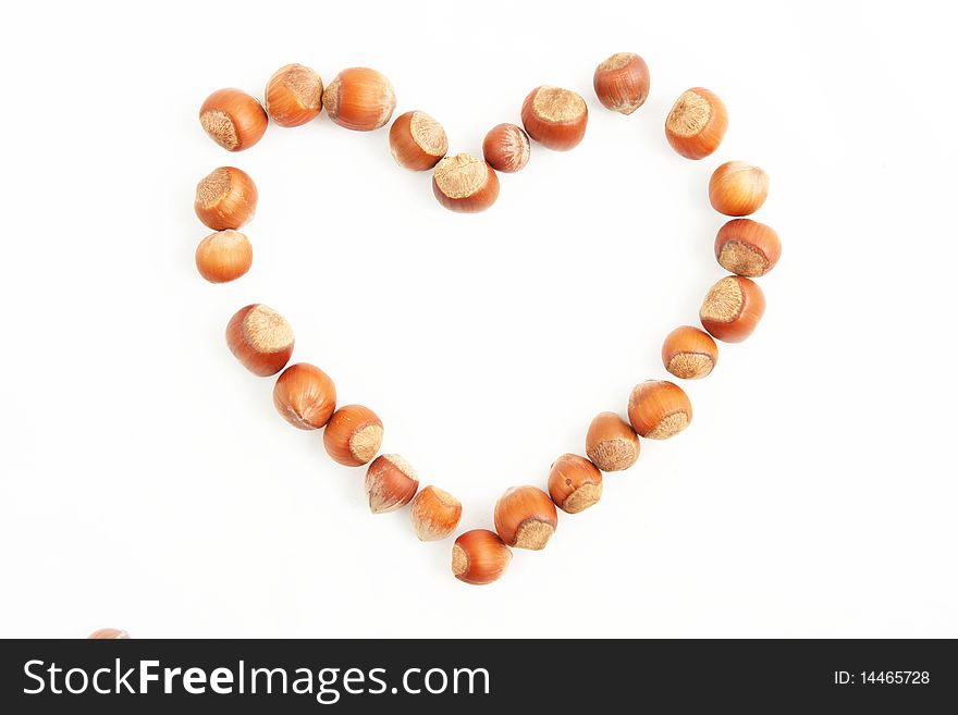 A nuts in shape of heart isolated on white