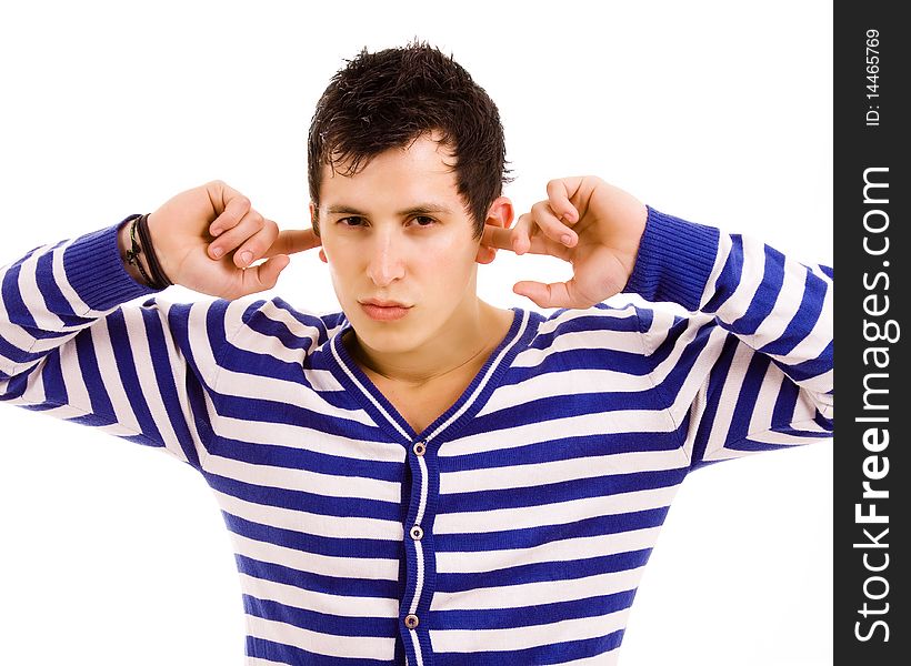 Young man with fingers in ears isolated on white