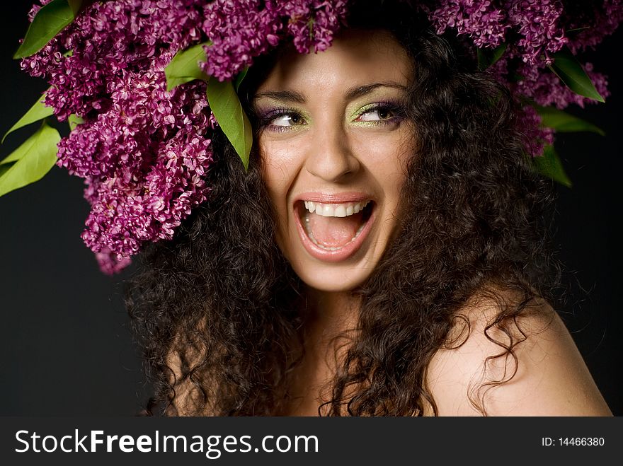 Girl in lilac garland laughing