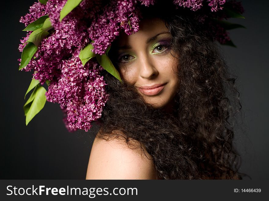 Girl in lilac garland smiling