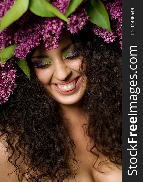 Girl in lilac garland laughing