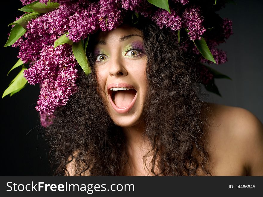 Girl in lilac garland laughing