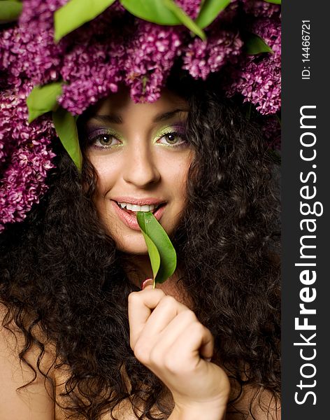 Girl in lilac garland smiling