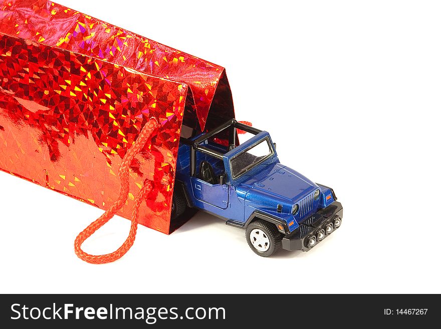 Car-SUV and a bag for purchases on a white background