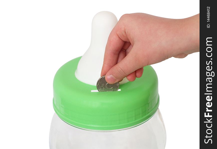 Fingers of a children's hand throwing a coin in a coin box close up on a white background it is isolated. Fingers of a children's hand throwing a coin in a coin box close up on a white background it is isolated