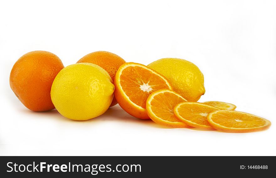 Oranges and lemons on white background