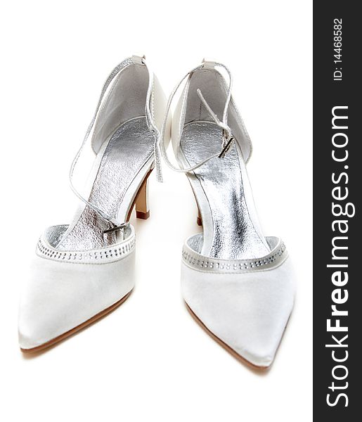 Pair silvery feminine loafers insulated on white background