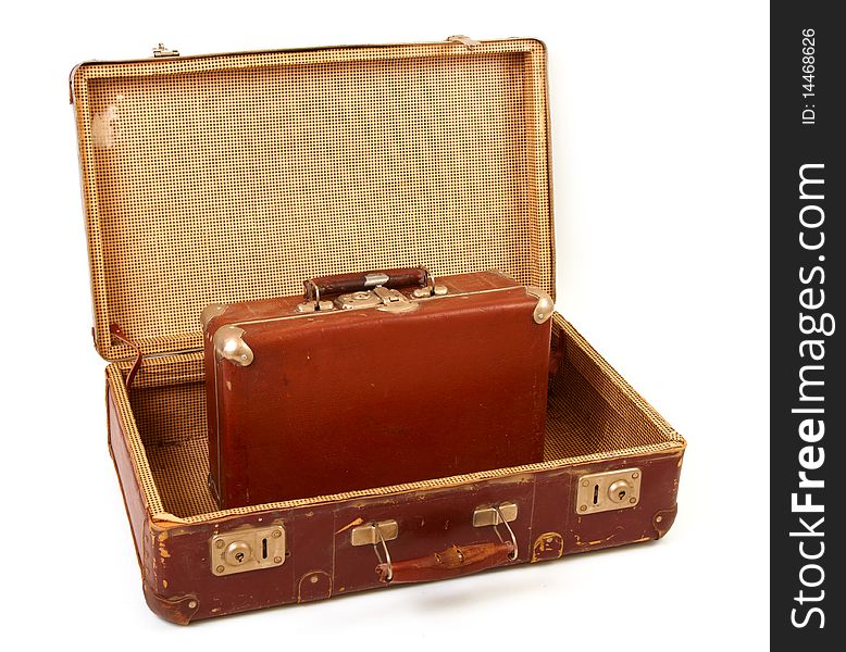 Two old suitcases for travel on white background