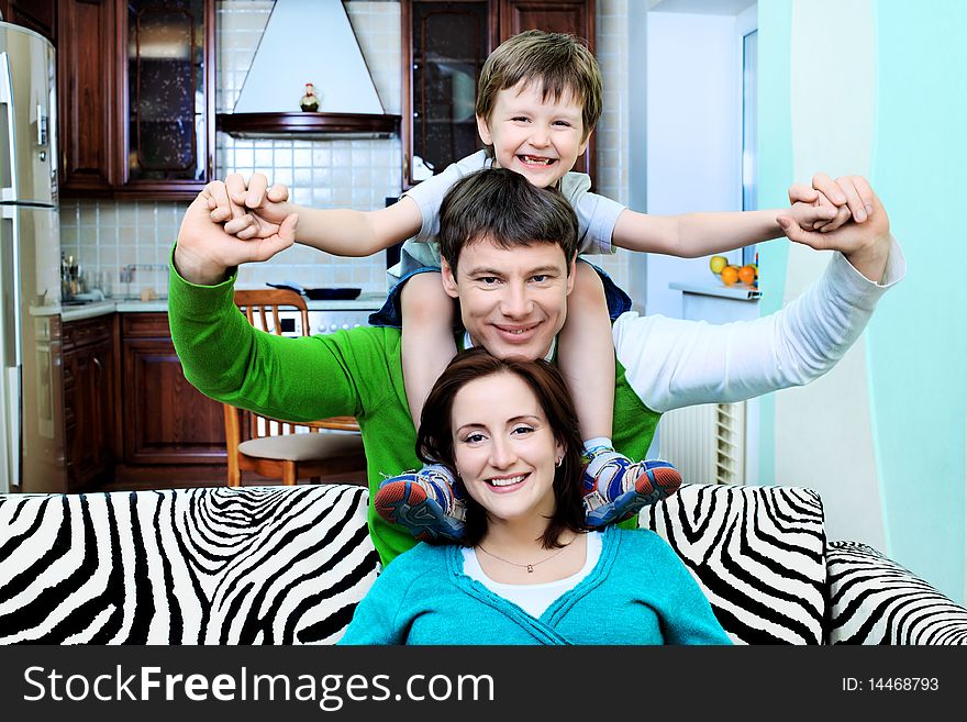 Happy family with a child at home. Happy family with a child at home.