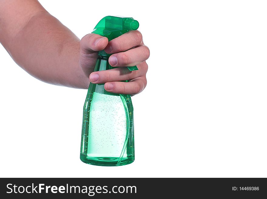 The man's hand holds a spray for water dispersion.