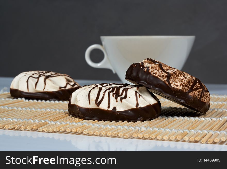 Sweet dessert cakes marshmallows covered with chocolate