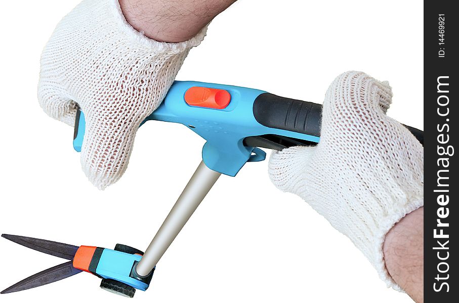 Man's hands in gloves and long handle garden scissors on a white background. Man's hands in gloves and long handle garden scissors on a white background