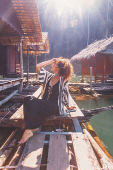 Beautiful Young Stylish Boho Woman At Wooden Floating Village Royalty Free Stock Photography