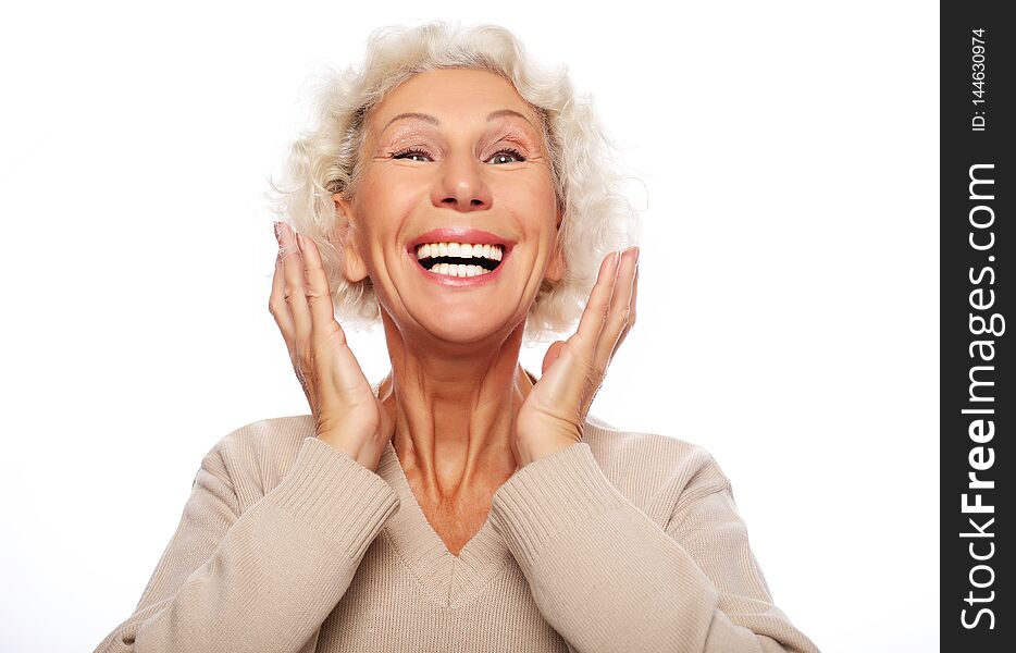 Lifestyle, emotion  and people concept: Grey haired old nice beautiful laughing woman. Isolated over vwhite  background. Close up.