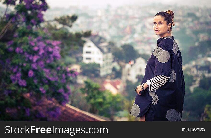 Woman overlooking the city view, Dalat, Vietnam