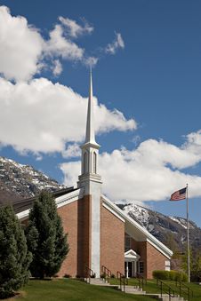 Church, Steeple, Mountains And US Flag Royalty Free Stock Photo