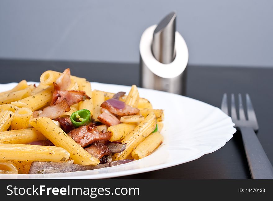Penne with fried bacon garlic and onion