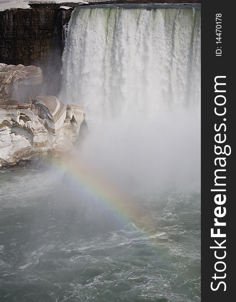 Rainbow over the waterfall and ice block. Rainbow over the waterfall and ice block