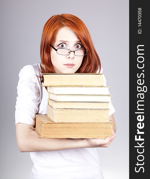 Red-haired smiling businesswoman  keep books