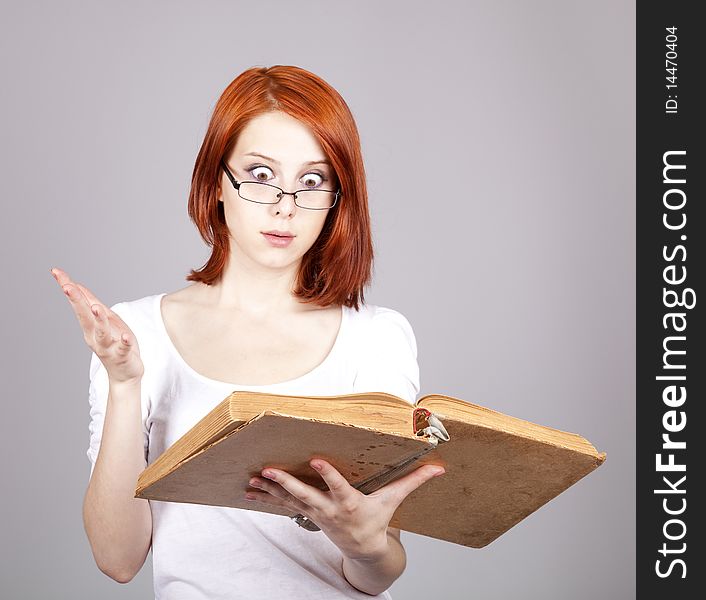 Red-haired businesswoman  keep books