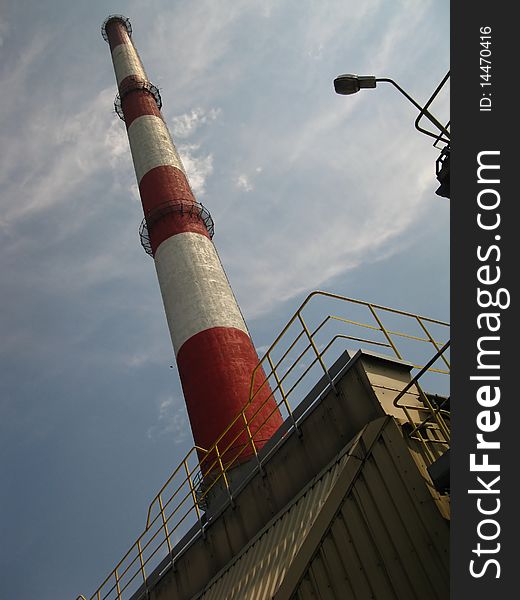 Red and white chimney in the old plant