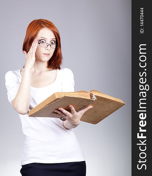 Red-haired businesswoman  keep books