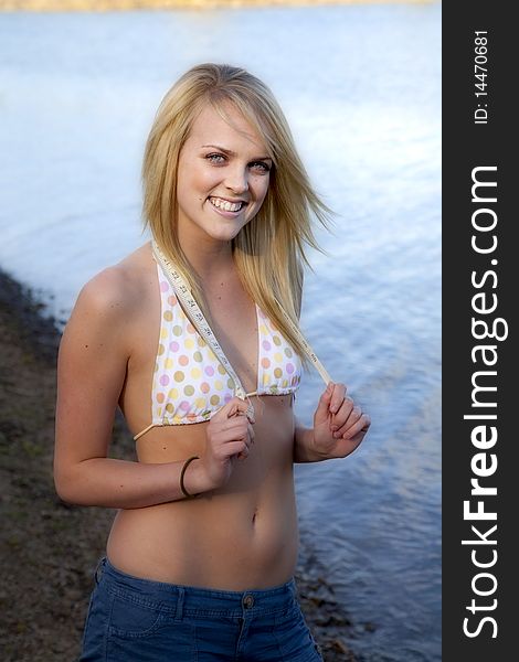 Woman On Beach With A Tape