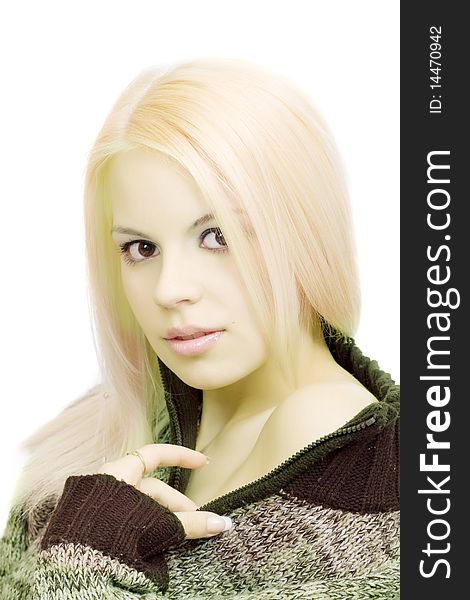 Young blonde woman in sweater with make-up on white background