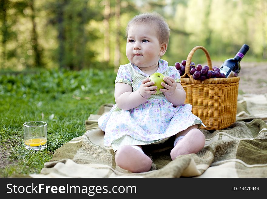 Cute baby girl having lunch in the nature. Cute baby girl having lunch in the nature