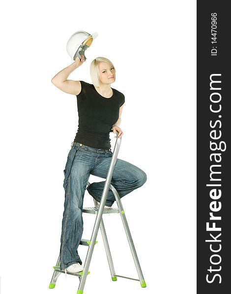 Blonde woman in jeans with helmet in ladder. Blonde woman in jeans with helmet in ladder