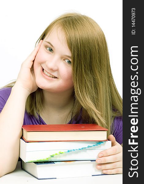 Smiling young girl with books isolated. Smiling young girl with books isolated