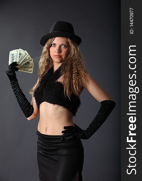 Girl In A Hat Holding A Dollars