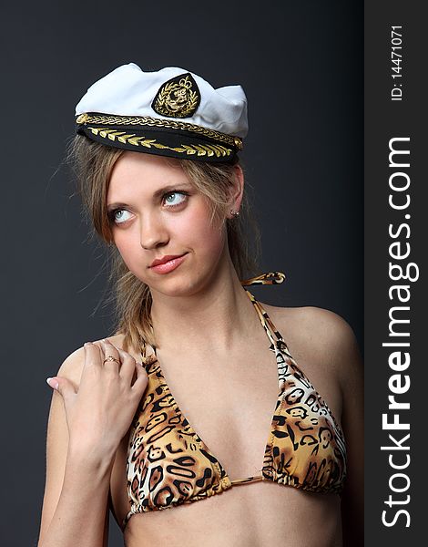 Girl In A Sailor S Cap And Swimsuit