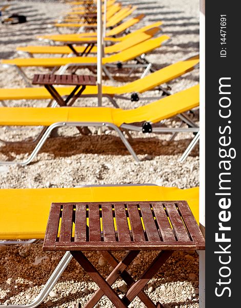 Yellow deckchair on a beach