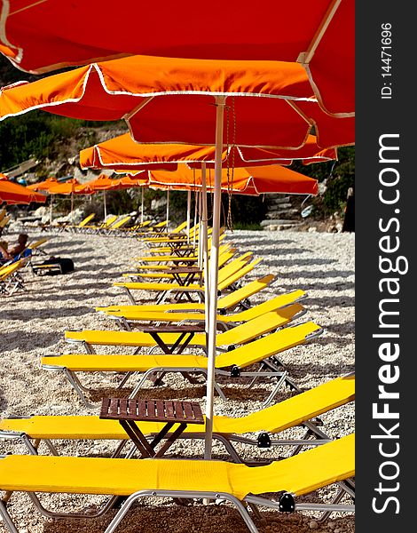 Yellow deckchair on a beach