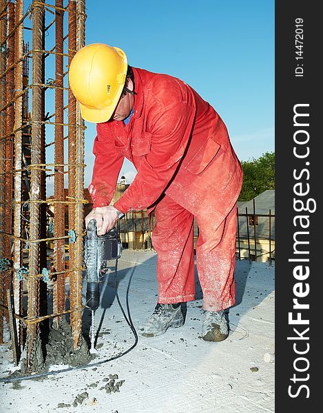 Construction worker builder during formwork installation for concrete filling. Construction worker builder during formwork installation for concrete filling